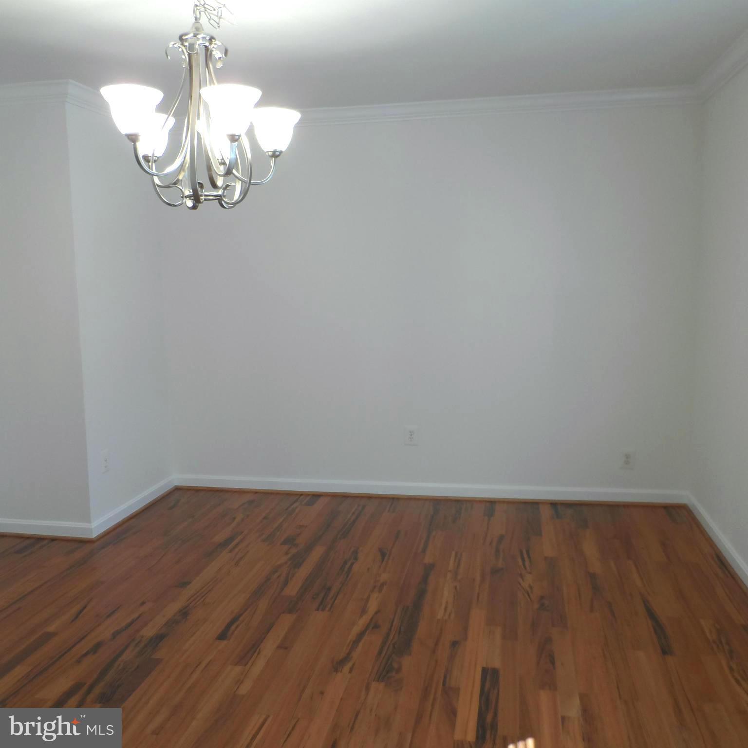 6607 Huntsman Boulevard Springfield, VA 22152 - Photo 3 of 30 Tiger Wood Floors in Reconfigured Dining Rm