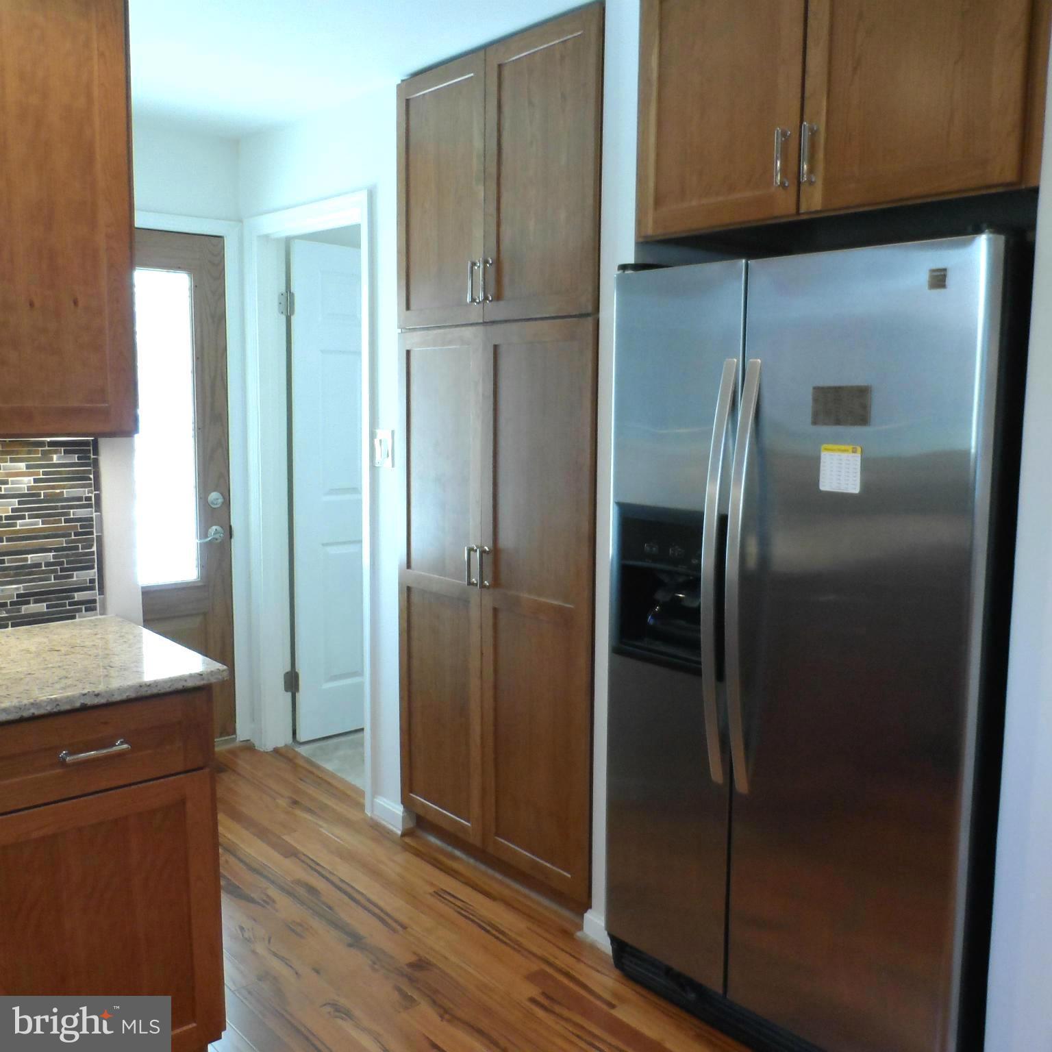 6607 Huntsman Boulevard Springfield, VA 22152 - Photo 7 of 30 Side by Side Frig Pantry with Pullout shelves
