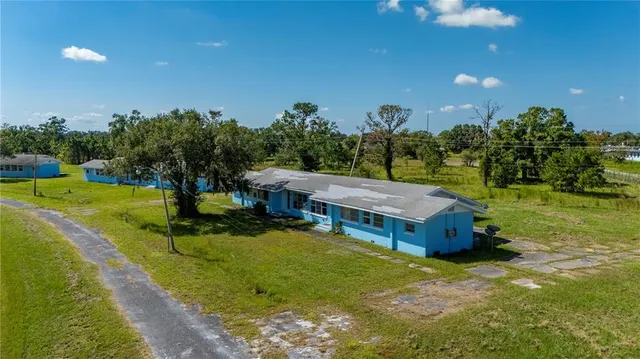 an aerial view of a house with a garden