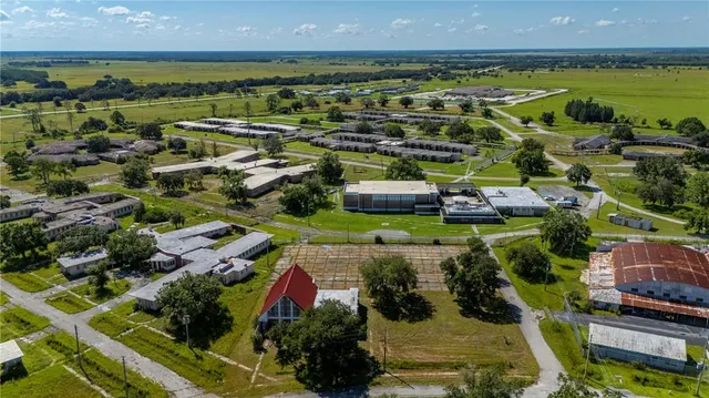 an aerial view of a building with outdoor area