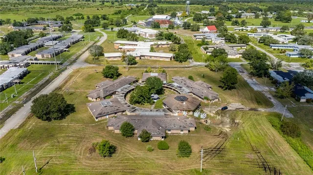 an aerial view of a house with outdoor space