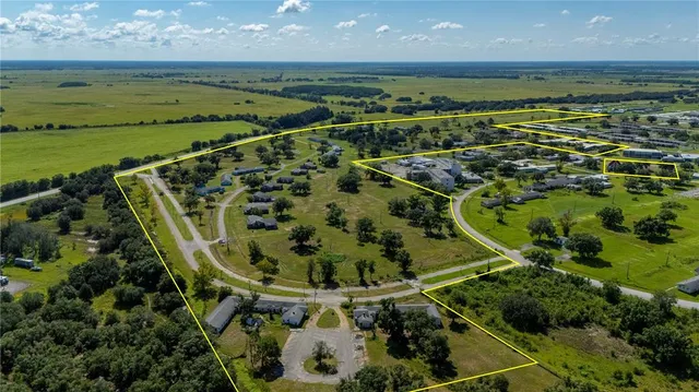 a view of a field with an ocean