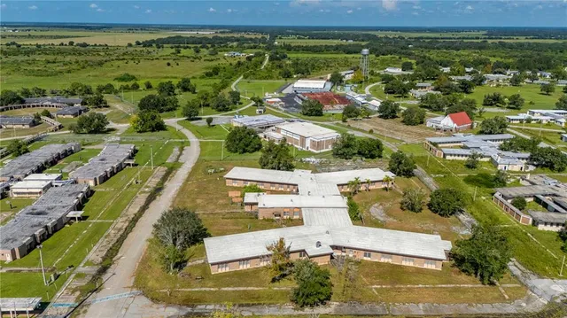 a view of a swimming pool with a yard