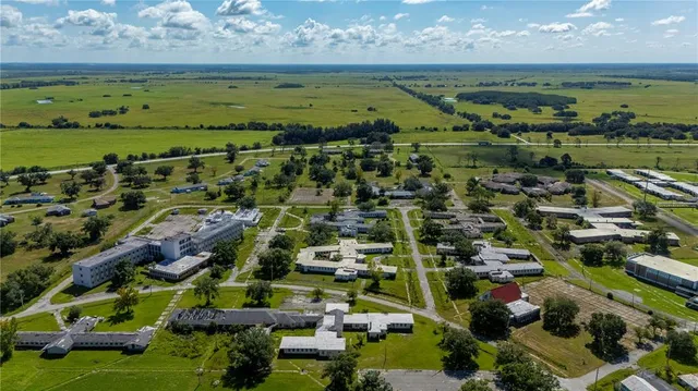 a view of a swimming pool with a yard