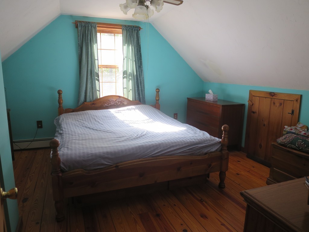 3189 Greenwich Road Hardwick, MA 01082 - Photo 17 of 27 a bedroom with a bed wooden floor and window