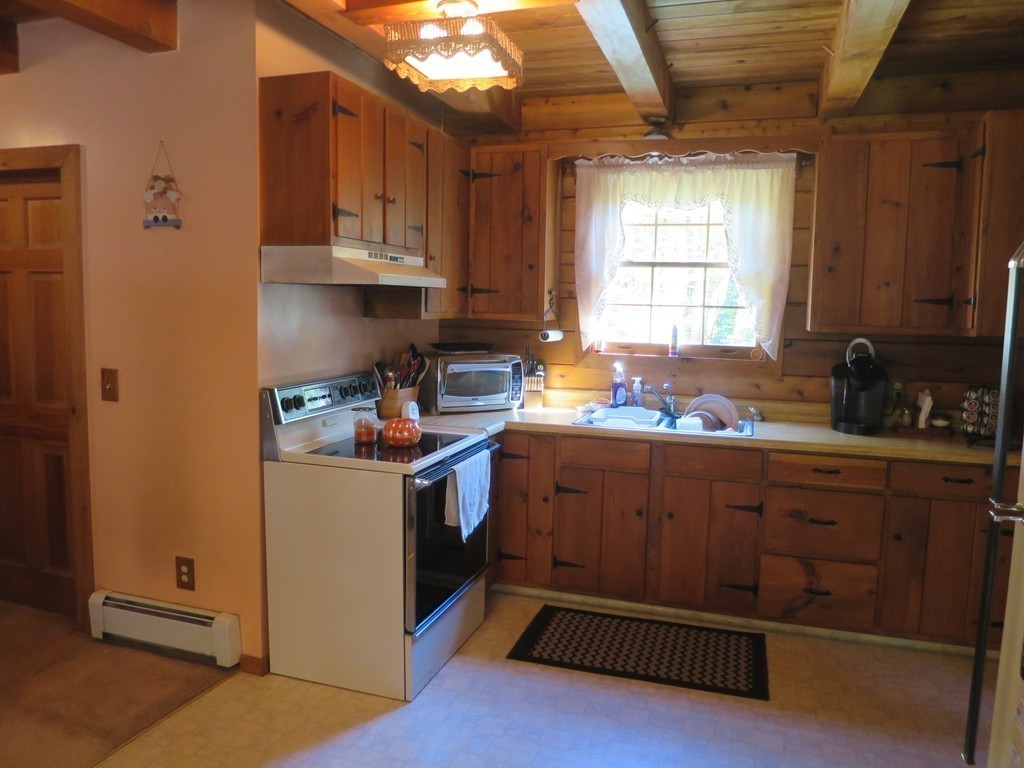 3189 Greenwich Road Hardwick, MA 01082 - Photo 7 of 27 a kitchen with sink cabinets and window