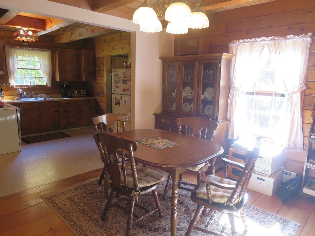 3189 Greenwich Road Hardwick, MA 01082 - Photo 9 of 27 a view of a dining room with furniture and a chandelier