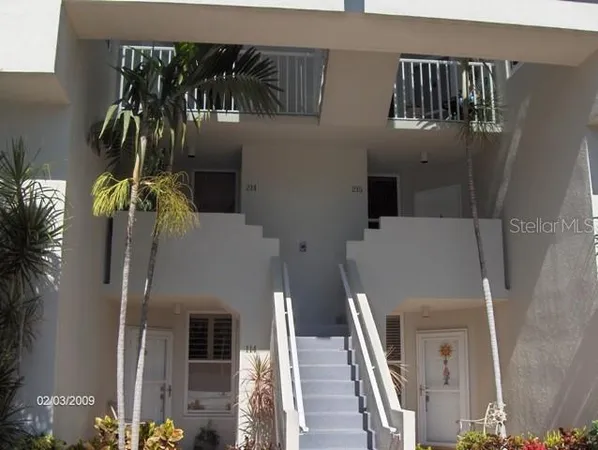 a front view of a house with a garage