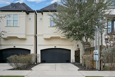 a front view of a house with garage