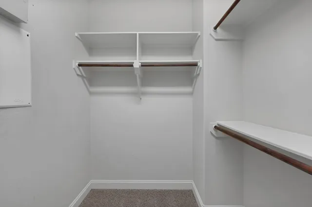 a view of an empty walk in closet
