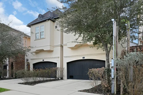 a front view of a house with entrance gate