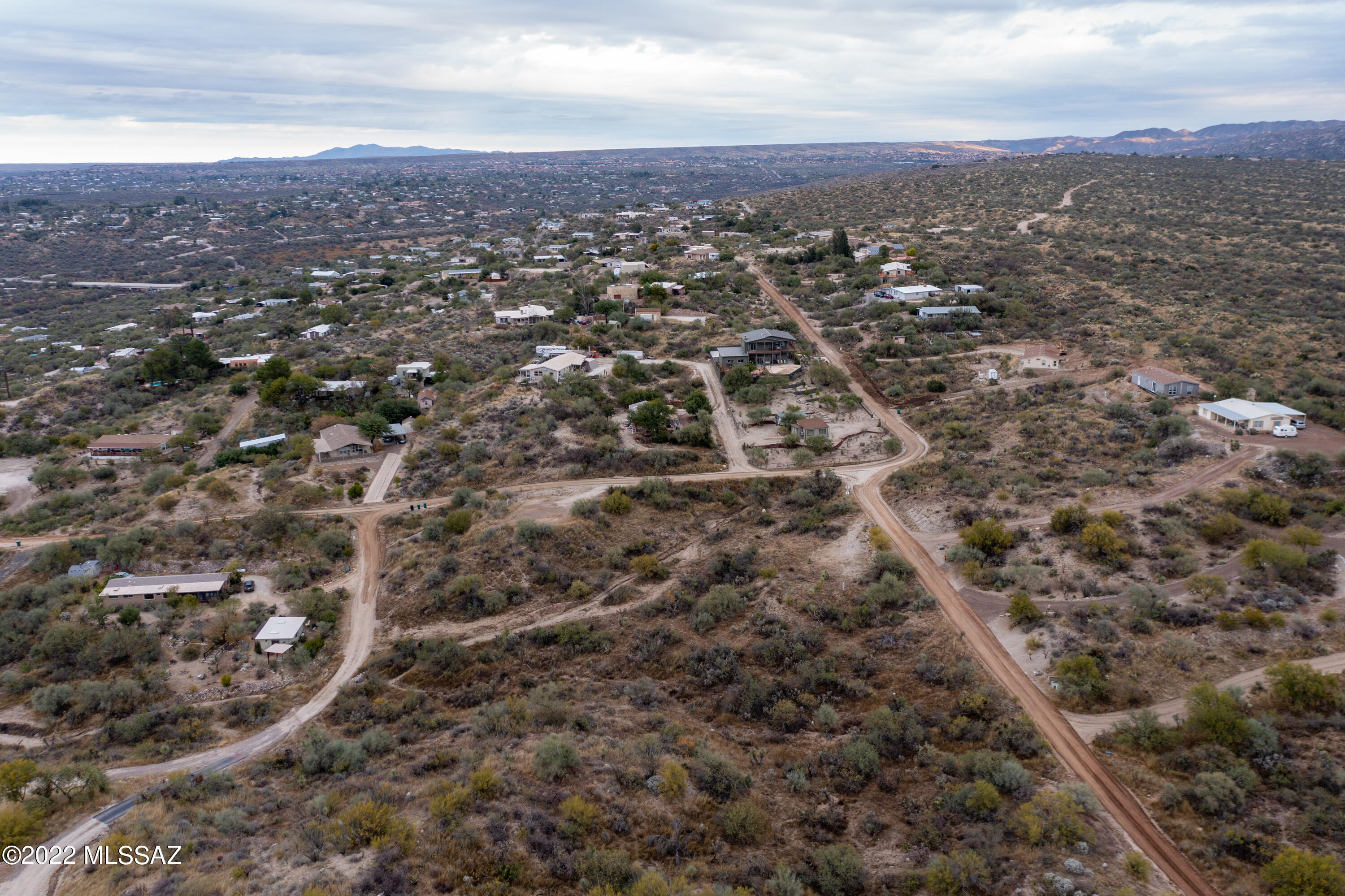 14597 North Swan Road Tucson, AZ 85739 - Photo 30 of 34 an aerial view of house with yard and mountain view in back
