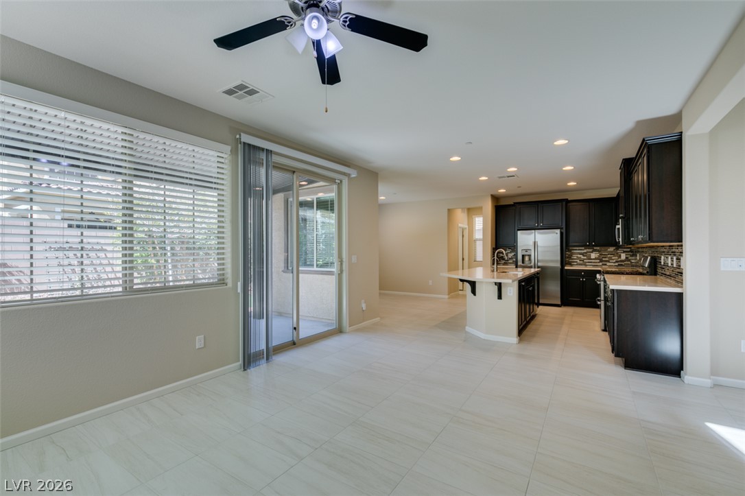 2549 Sable Ridge Street Henderson, NV 89044 - Photo 47 of 48 An open floorplan offers seamless transitions between the living area and a well-appointed kitchen.