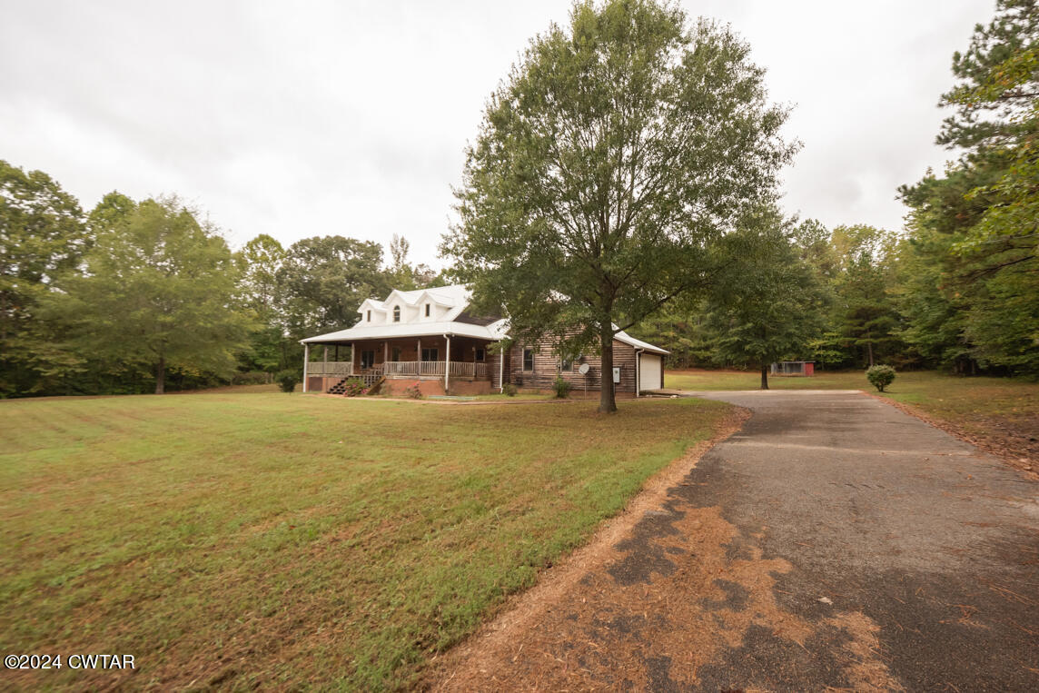 4392 Alberton Road Lexington, TN 38351 - Photo 2 of 75 a view of a house with a yard