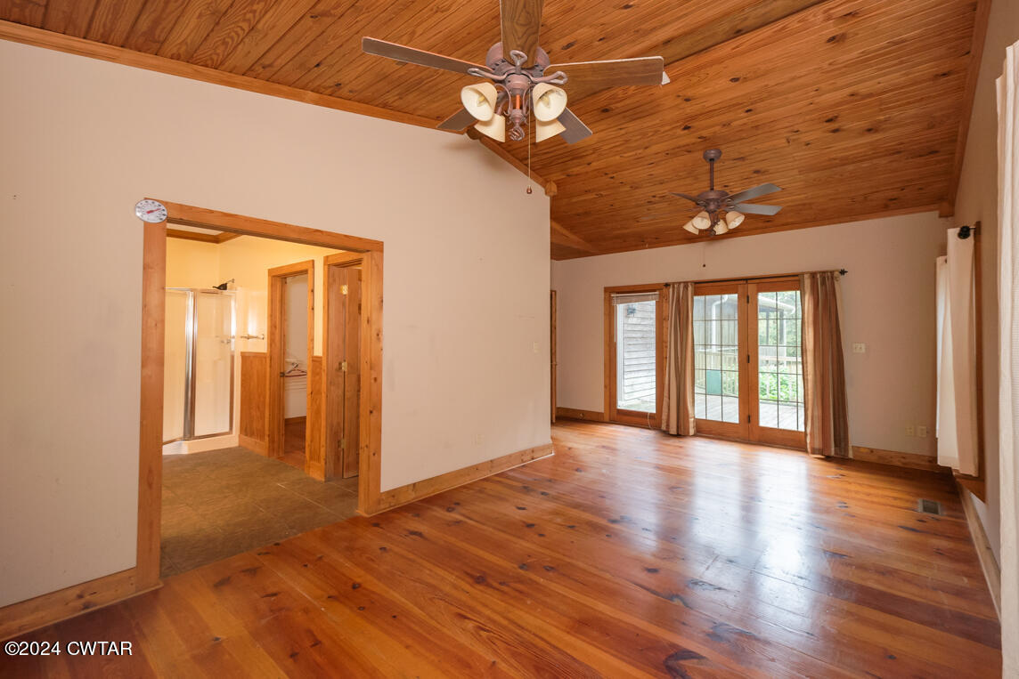 4392 Alberton Road Lexington, TN 38351 - Photo 33 of 75 a view of an empty room with wooden floor and a window