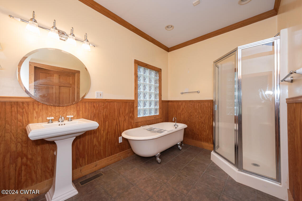 4392 Alberton Road Lexington, TN 38351 - Photo 35 of 75 a bathroom with a toilet sink and mirror