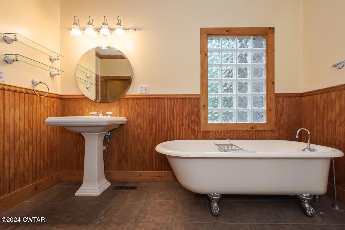4392 Alberton Road Lexington, TN 38351 - Photo 36 of 75 a view of a bathtub in a bathroom