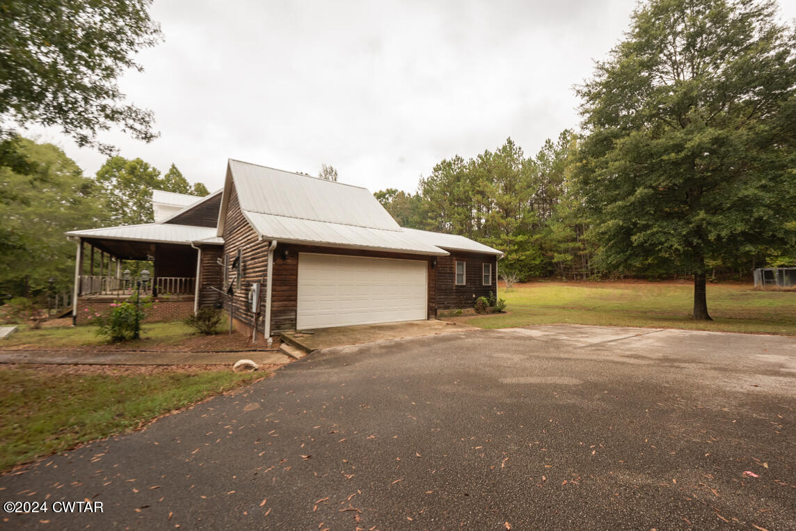 4392 Alberton Road Lexington, TN 38351 - Photo 4 of 75 a view of a house with backyard and trees