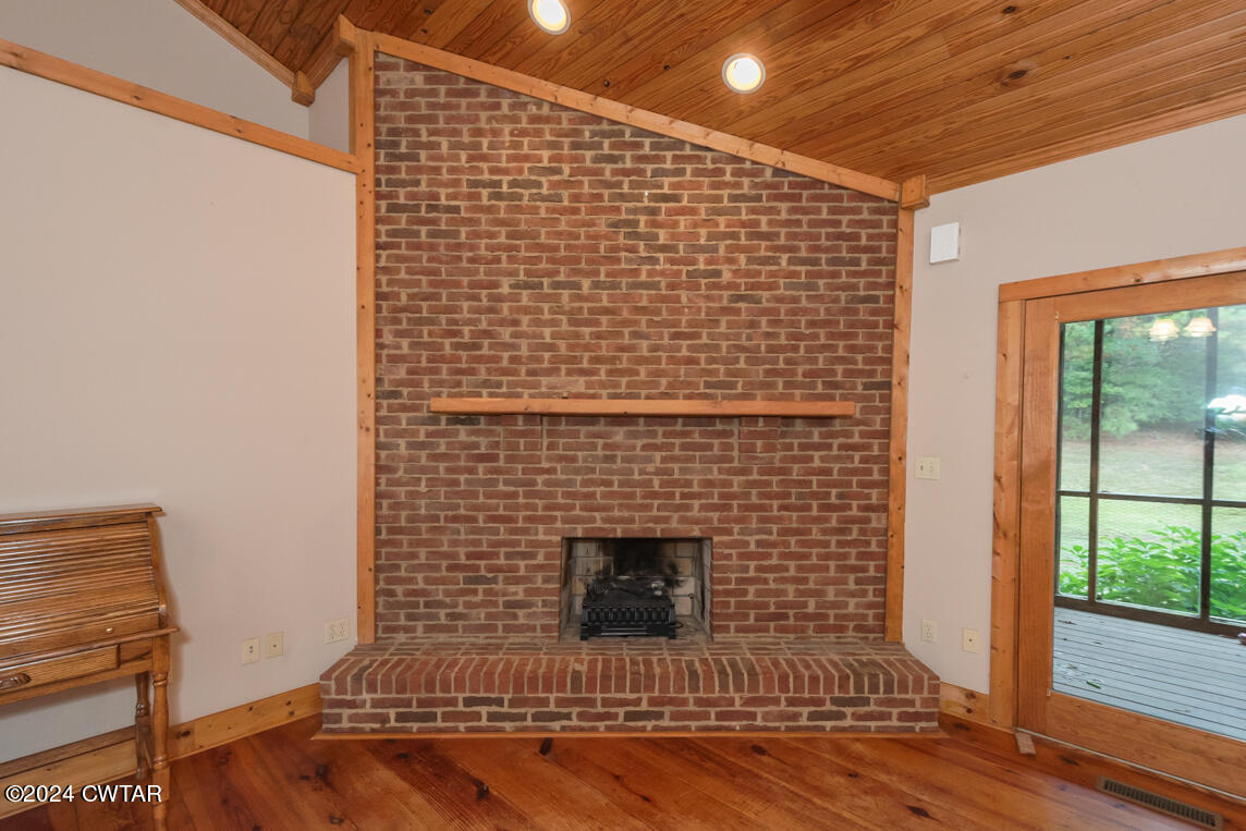 4392 Alberton Road Lexington, TN 38351 - Photo 42 of 75 a view of a livingroom with wooden floor and a fireplace