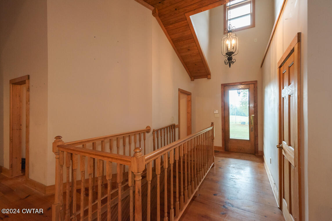 4392 Alberton Road Lexington, TN 38351 - Photo 46 of 75 a view of a hallway with wooden floor and staircase