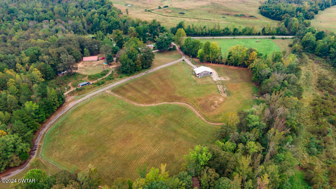 4392 Alberton Road Lexington, TN 38351 - Photo 67 of 75 an aerial view of a house with a yard and lake view