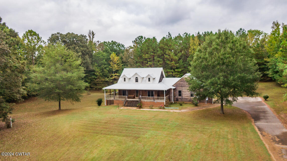 4392 Alberton Road Lexington, TN 38351 - Photo 70 of 75 a view of a lake with houses