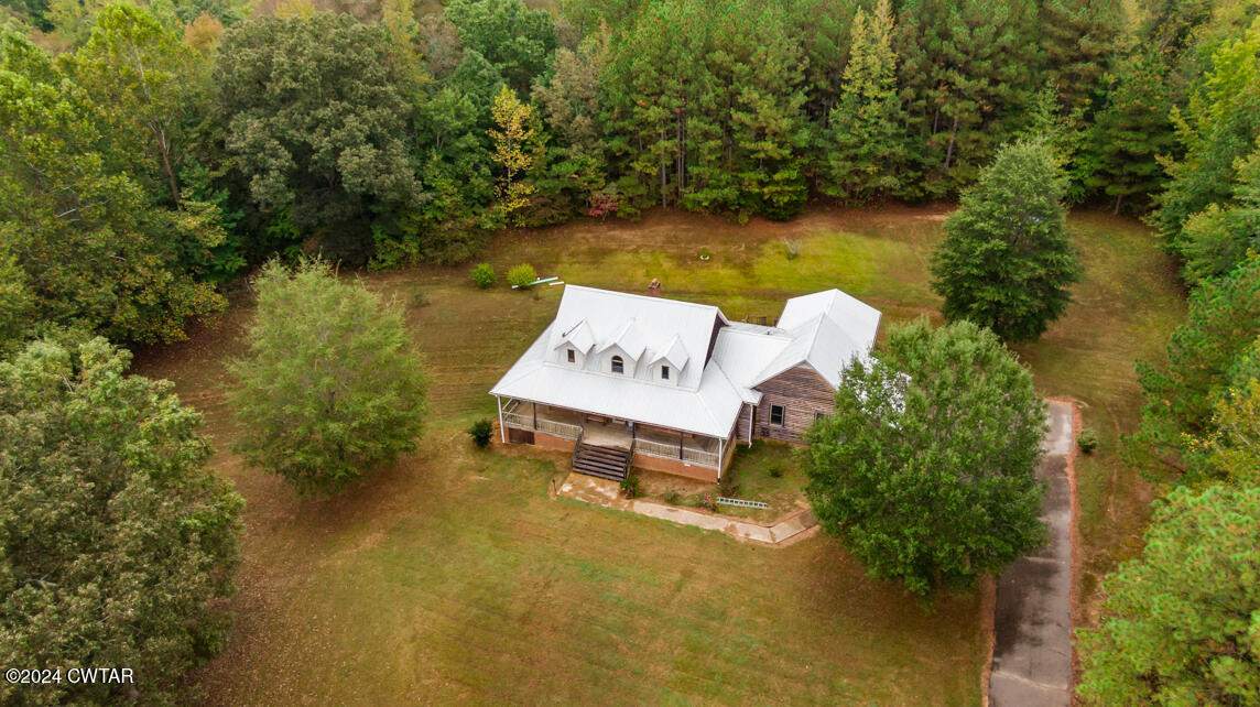 4392 Alberton Road Lexington, TN 38351 - Photo 71 of 75 a view of a lake with couches and wooden fence