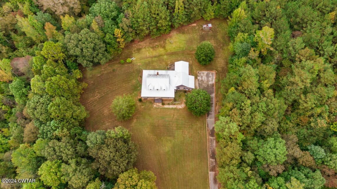 4392 Alberton Road Lexington, TN 38351 - Photo 73 of 75 an aerial view of residential house with outdoor space and trees all around