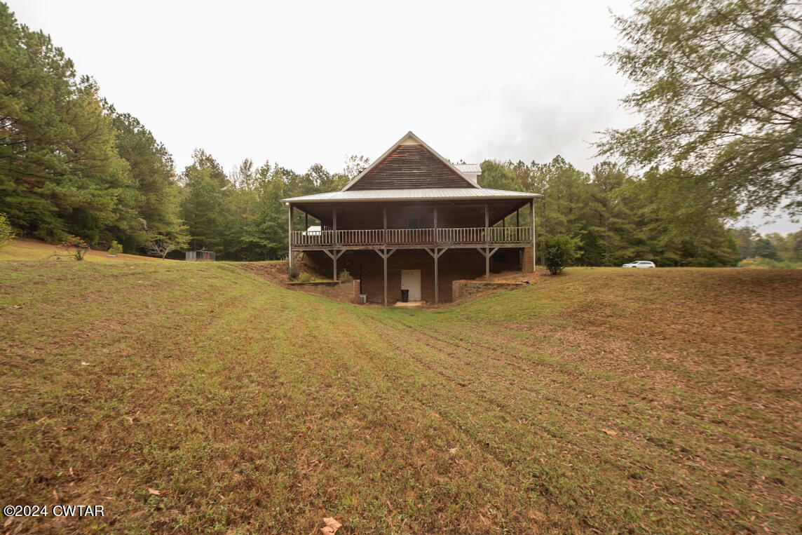 4392 Alberton Road Lexington, TN 38351 - Photo 10 of 75 a view of a house with yard and trampoline