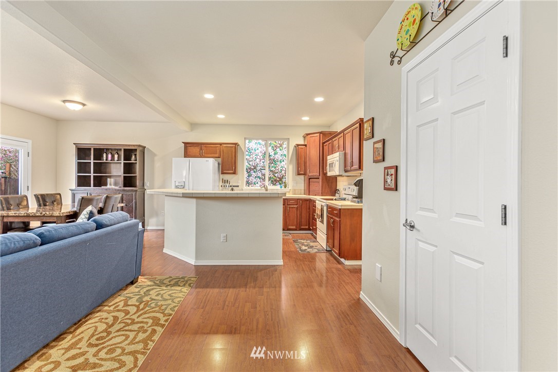 4313 147th Place Southeast Bothell, WA 98012 - Photo 13 of 29 a kitchen with a refrigerator and a counter top space