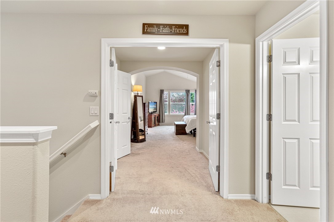 4313 147th Place Southeast Bothell, WA 98012 - Photo 16 of 29 a view of a hallway with wooden shelves