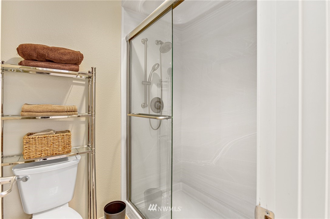 4313 147th Place Southeast Bothell, WA 98012 - Photo 20 of 29 a bathroom with a toilet and a shower