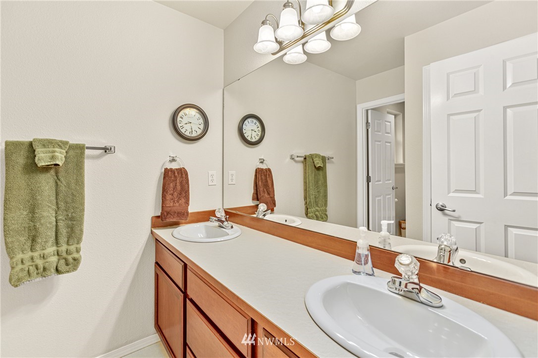 4313 147th Place Southeast Bothell, WA 98012 - Photo 26 of 29 a bathroom with a sink and a mirror