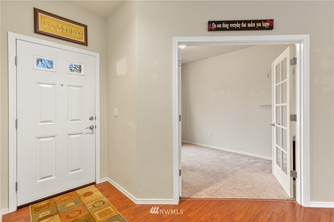 4313 147th Place Southeast Bothell, WA 98012 - Photo 4 of 29 a view of a bedroom with wooden floor and closet