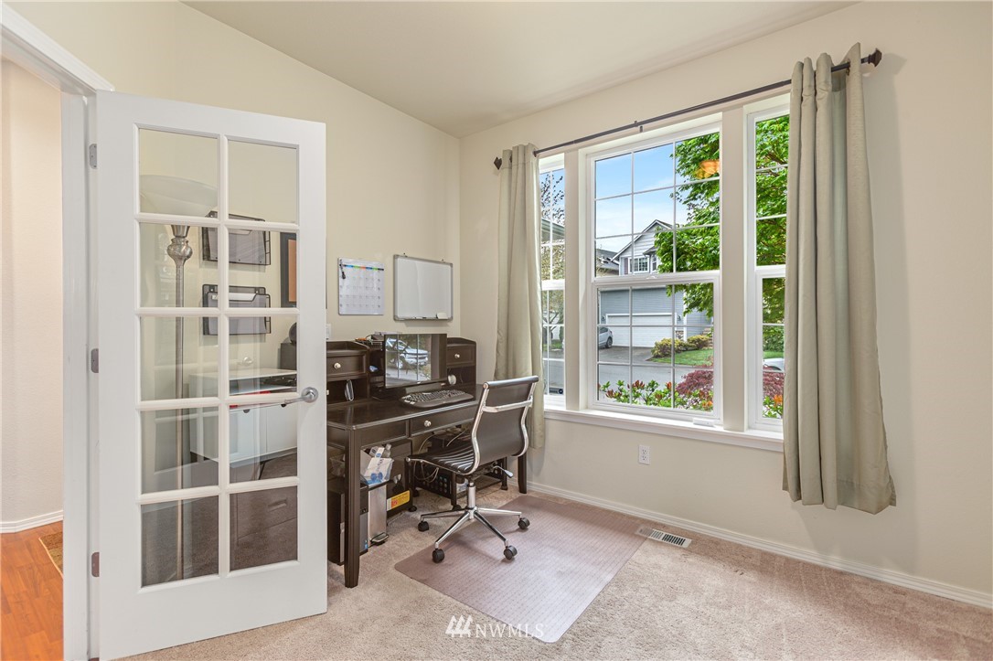 4313 147th Place Southeast Bothell, WA 98012 - Photo 6 of 29 a view of a workspace with furniture and a window