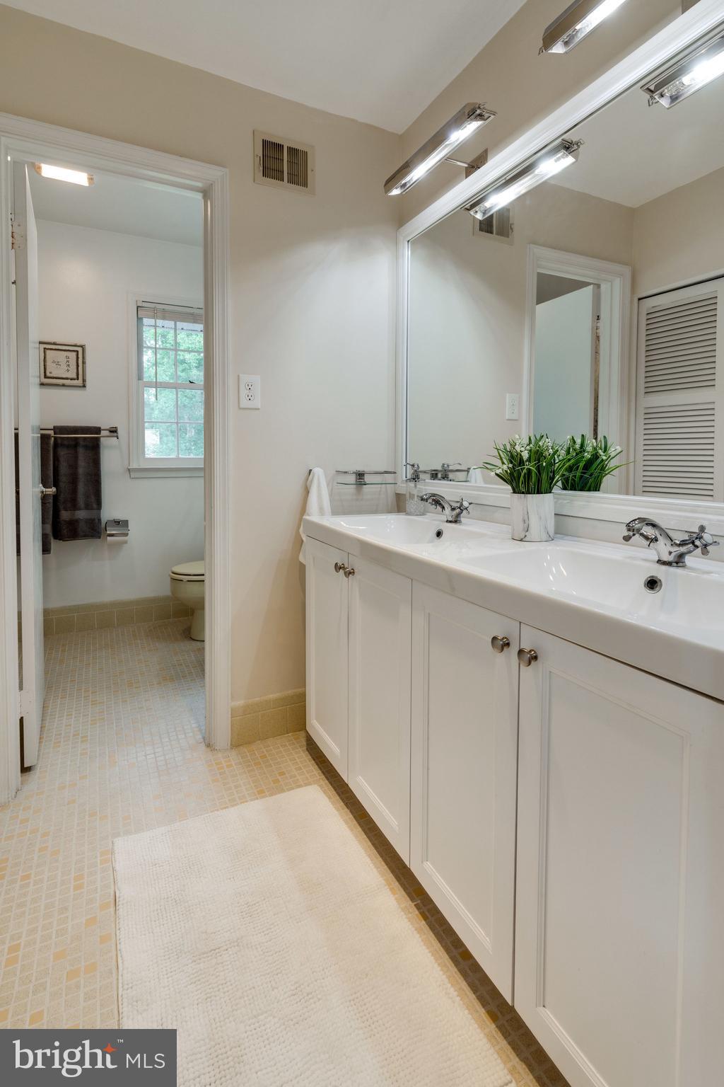 8313 Oakford Drive Springfield, VA 22152 - Photo 27 of 45 Upstairs Hall Bathroom Renovated & Restored