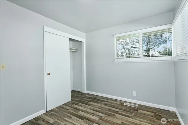 a view of room with window and hardwood floor
