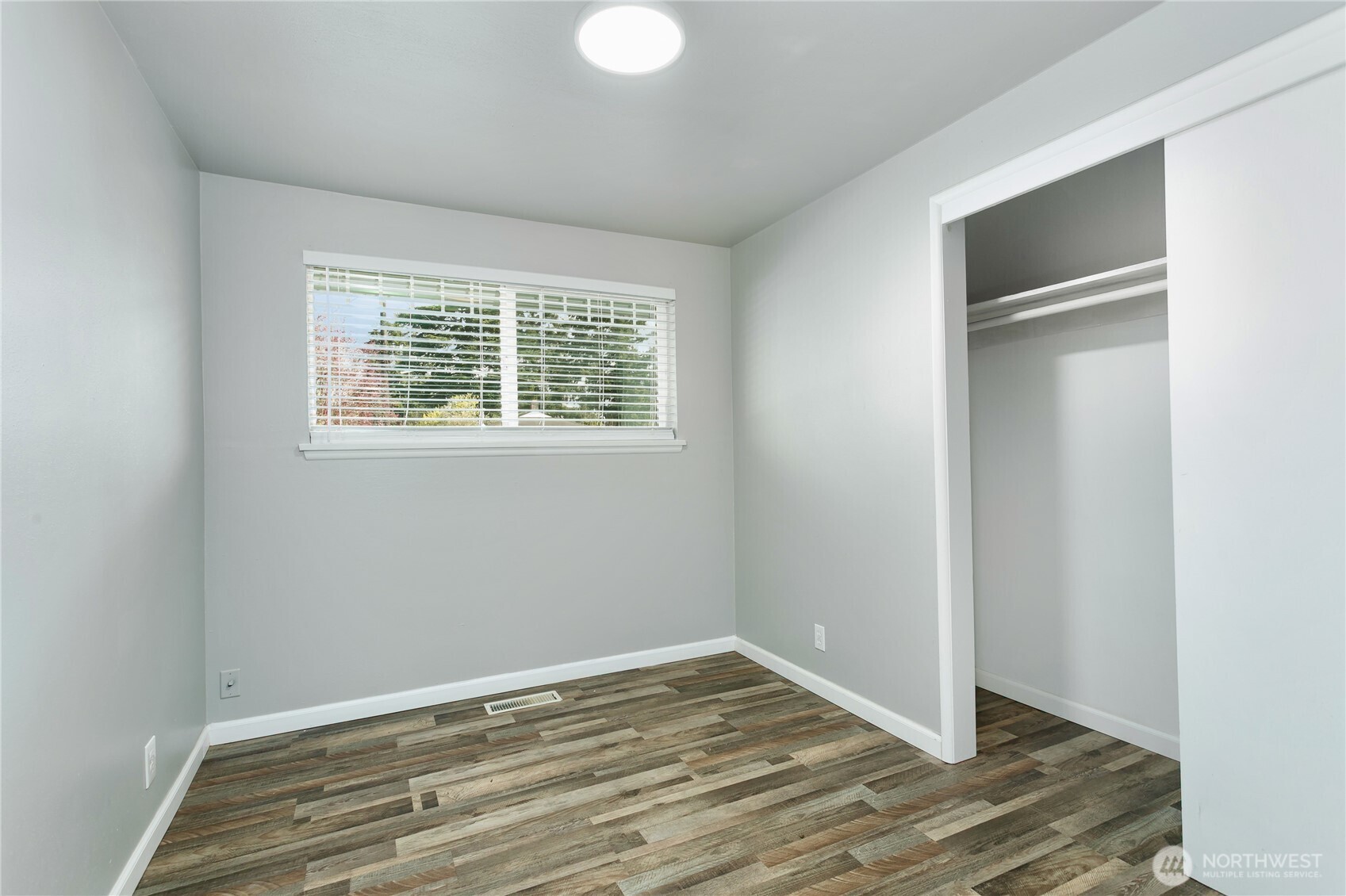 31327 12th Place South Federal Way, WA 98003 - Photo 23 of 40 a view of an empty room with wooden floor and a window