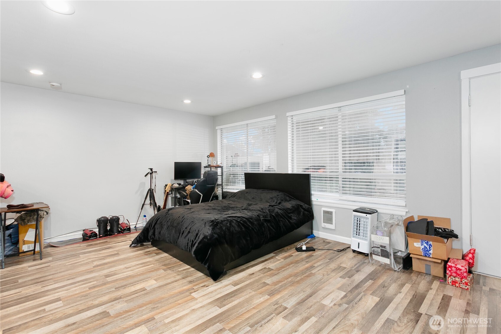 31327 12th Place South Federal Way, WA 98003 - Photo 32 of 40 a spacious bedroom with a bed and a wooden floor