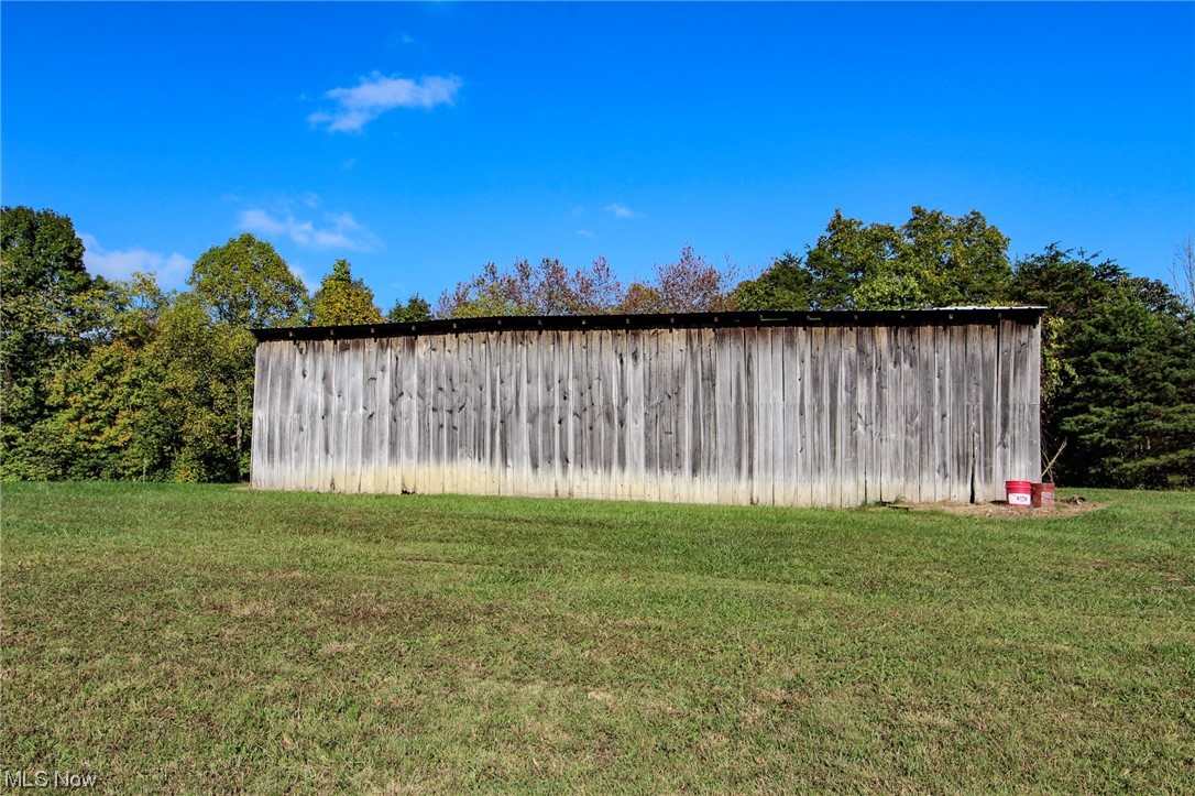 8570-8656 Federal Road Cutler, OH 45724 - Photo 15 of 24 View of shed / structure featuring a yard