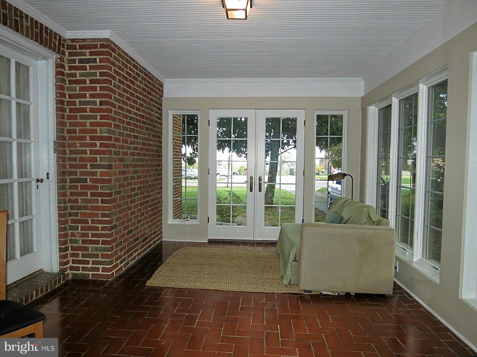 502 North Main Street Mount Airy, MD 21771 - Photo 11 of 27 a view of a porch with wooden floor and a yard