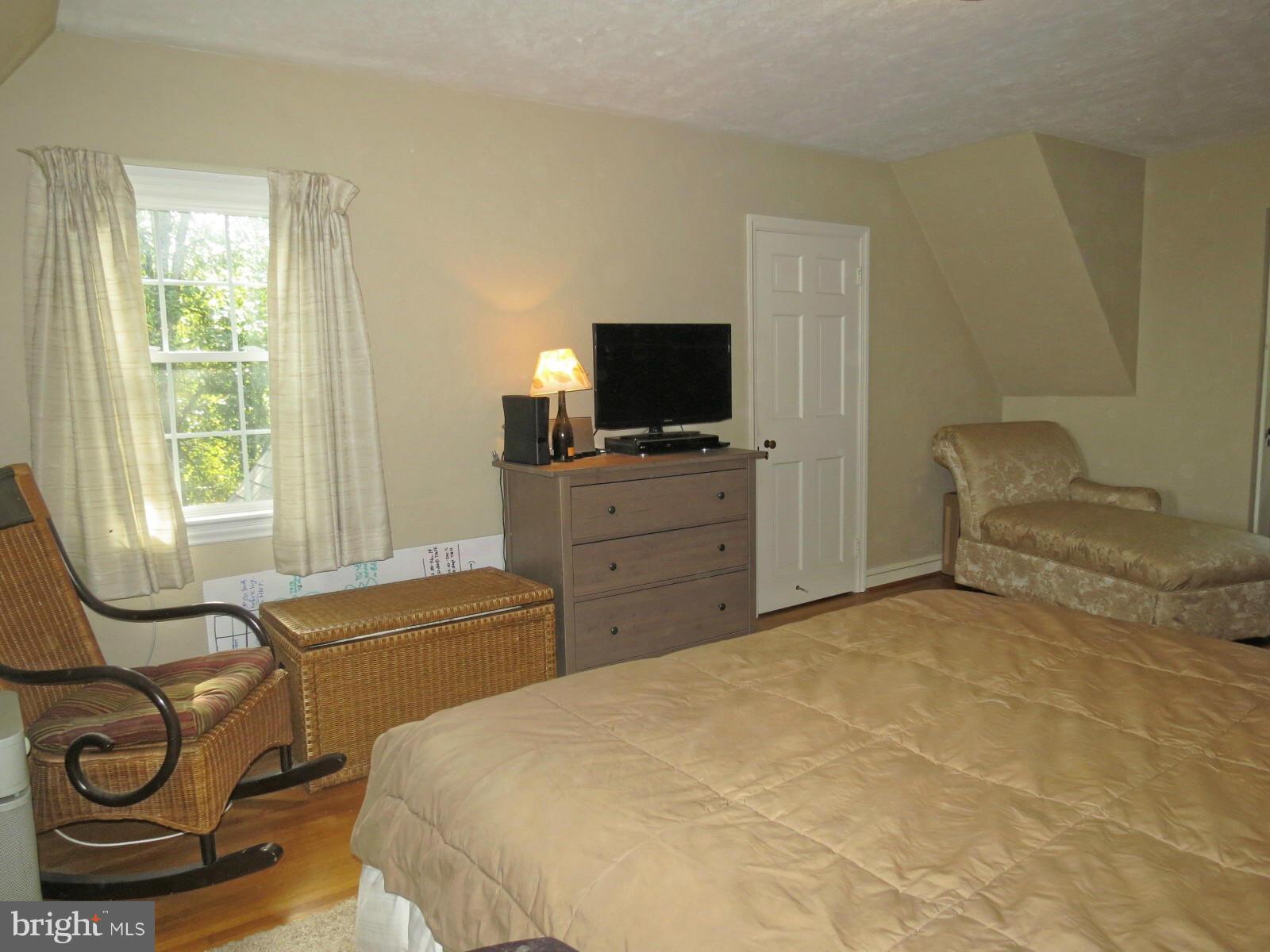 502 North Main Street Mount Airy, MD 21771 - Photo 20 of 27 a bedroom with a bed and flat screen tv