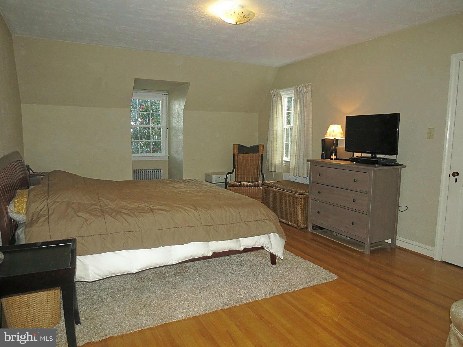502 North Main Street Mount Airy, MD 21771 - Photo 21 of 27 a bedroom with a bed and a flat screen tv