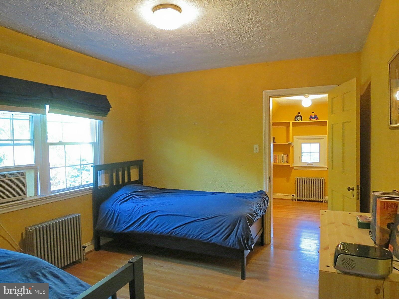 502 North Main Street Mount Airy, MD 21771 - Photo 23 of 27 a bedroom with a bed and wooden floor