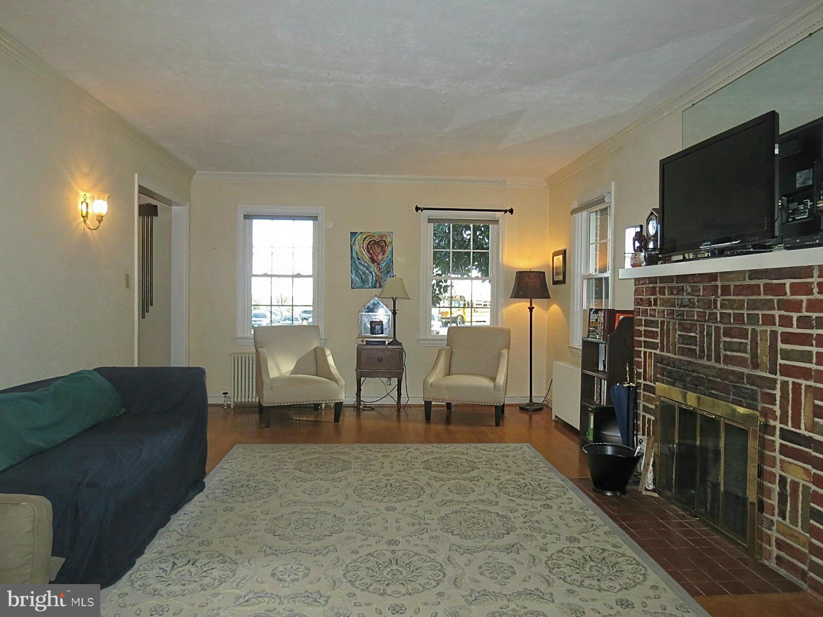502 North Main Street Mount Airy, MD 21771 - Photo 8 of 27 a living room with furniture and a flat screen tv