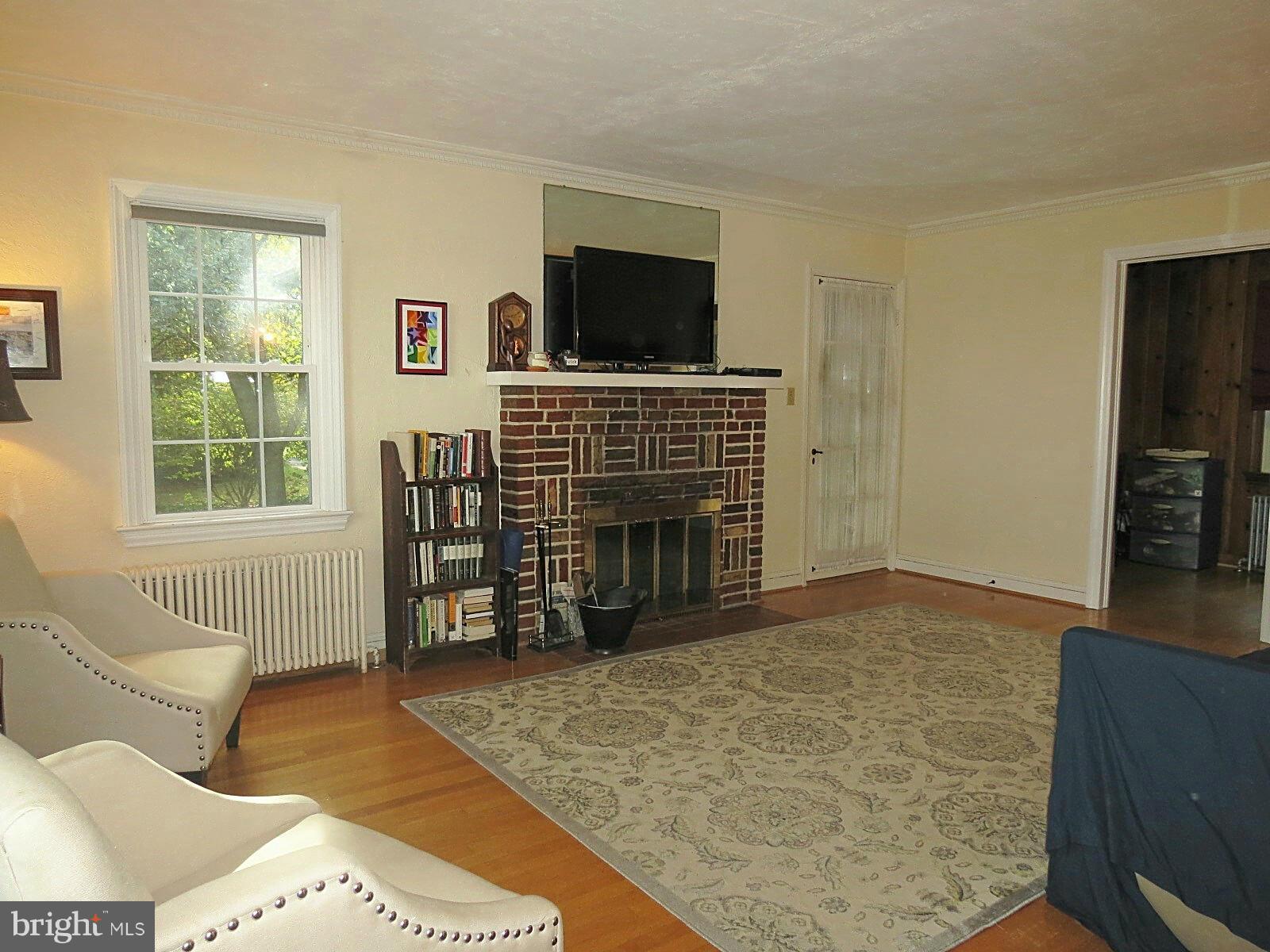 502 North Main Street Mount Airy, MD 21771 - Photo 9 of 27 a living room with furniture and a fireplace