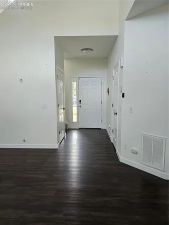 a view of room with window and hardwood floor
