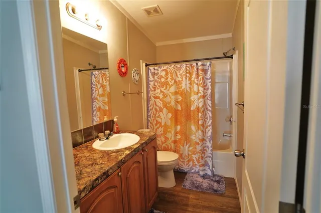 a bedroom with a bed and lamp