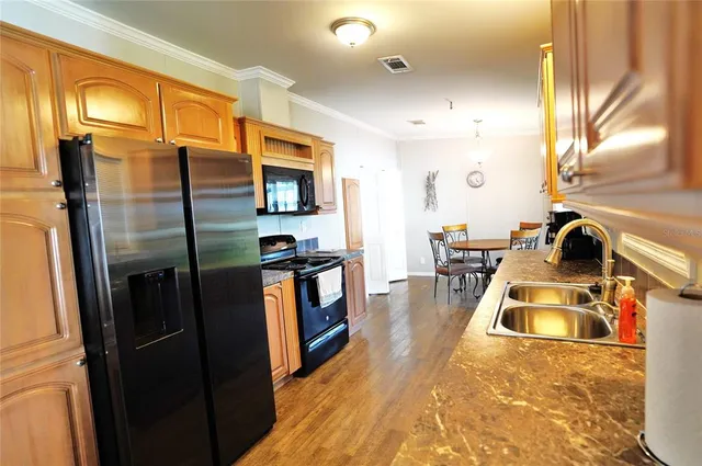 a view of a dining room with furniture and a window