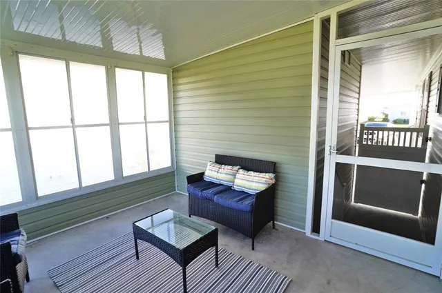 an aerial view of a residential houses with yard